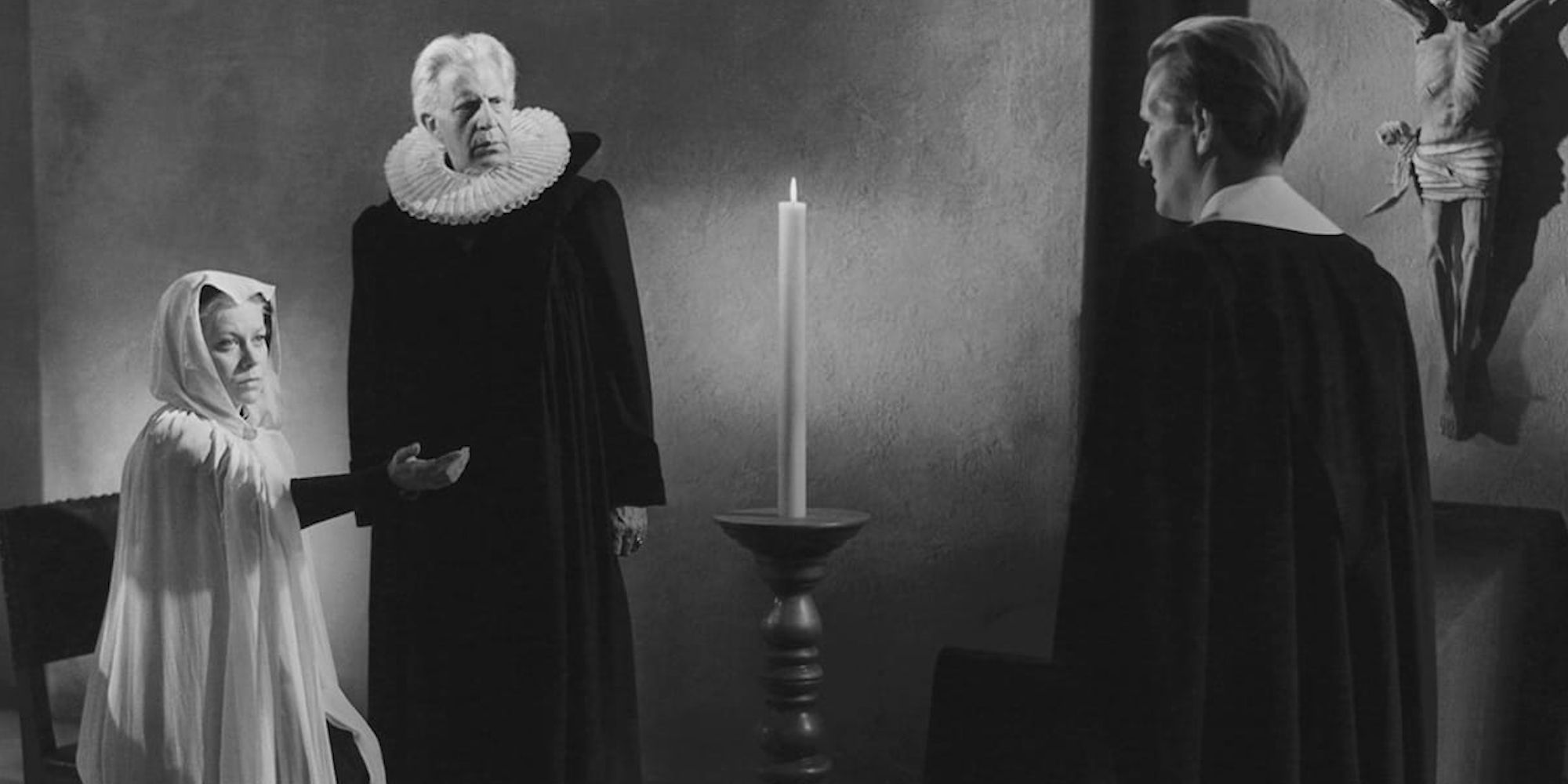 A nun pointing at a priest while another priest looks in the film Day of Wrath