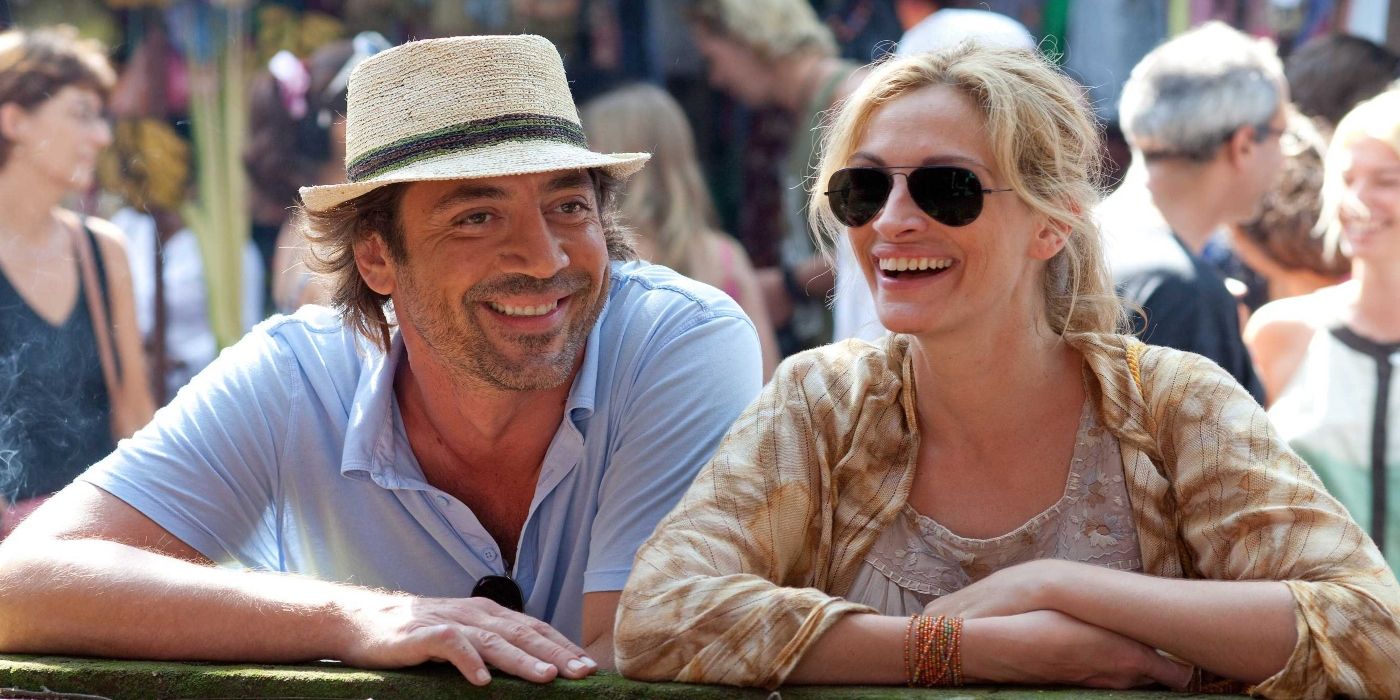 Javier Bardem and Julia Roberts in Eat Pray Love smiling while standing next to each other