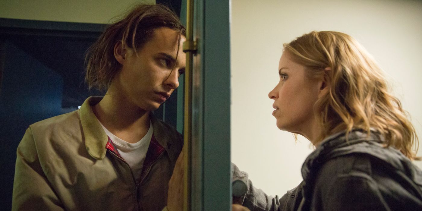 Madison and her son Nick looking at one another on either side of a glass door in Fear the Walking Dead.