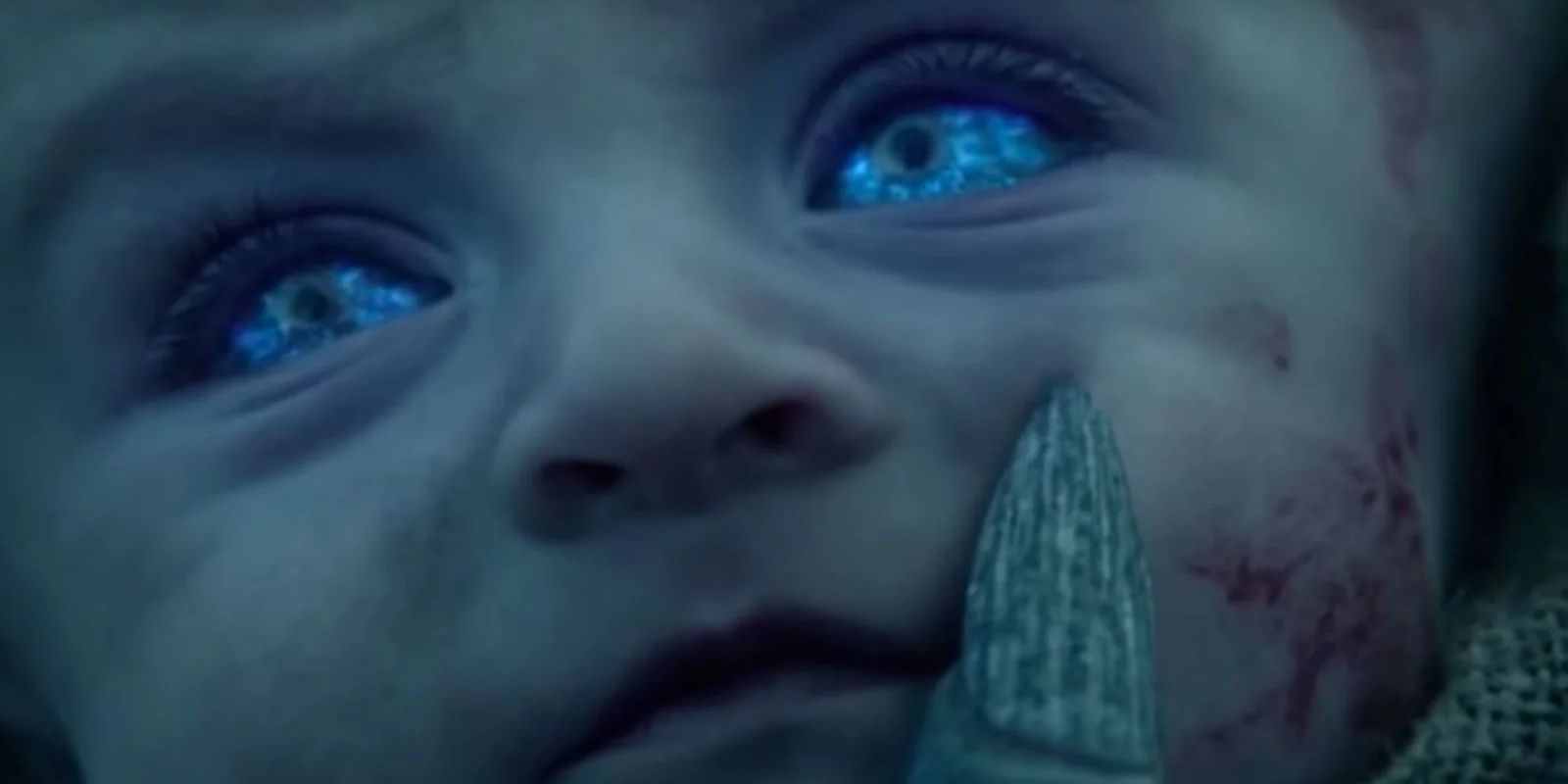 A baby turning into a White Walker, flashing the bleu eyes in Game of Thrones