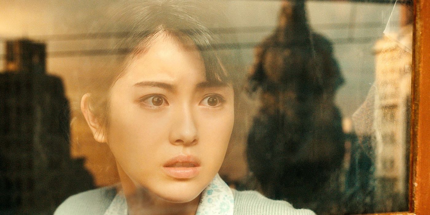 Minami Hamabe as Noriko Oishi staring out a window in Godzilla Minus One