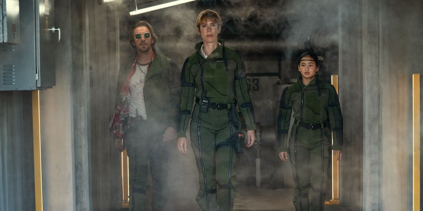 Dan Stevens as Trapper, Rebecca Hall as Dr. Ilene Andrews, and Kayle Hottle as Jia in Godzilla x Kong: The New Empire