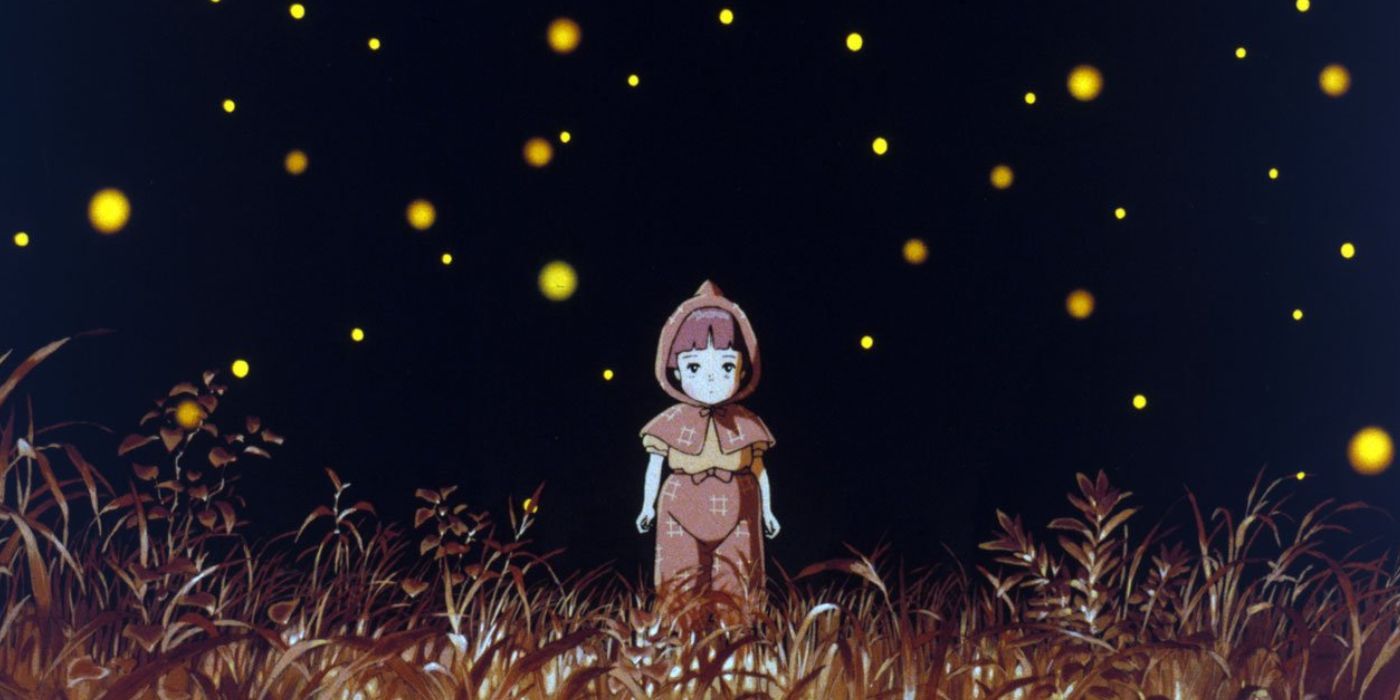 Setsuko standing in a field surrounded by twinkling fireflies.