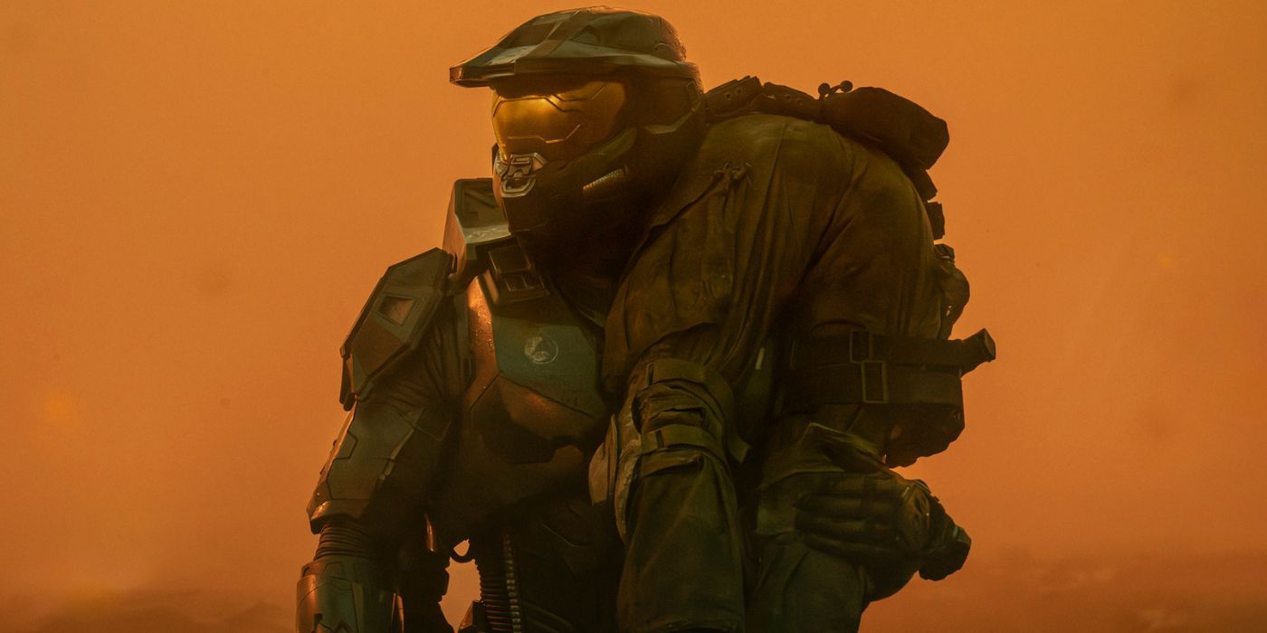 Master Chief (Pablo Schreiber) carrying a wounded soldier in Halo Season 2