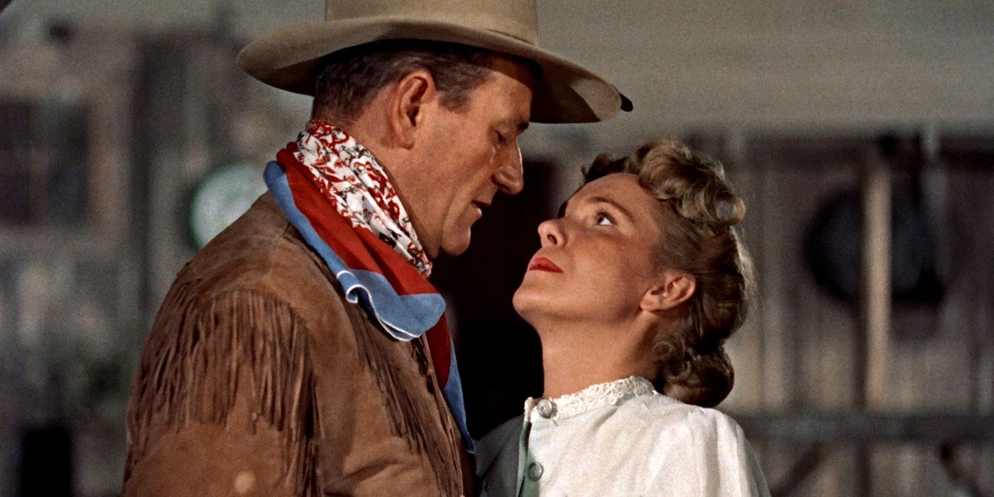 Geraldine Page as Angie and John Wayne as Hondo looking at each other lovingly in Hondo