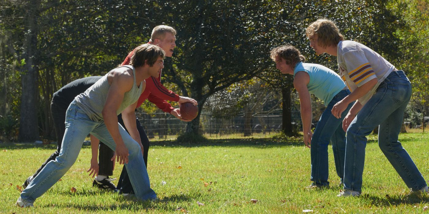 The Von Erich men, playing football: Kevin (Zac Efron), Fritz (Holy McCallany), David (Harris Dickinson), and Kerry (Jeremy Allen White)