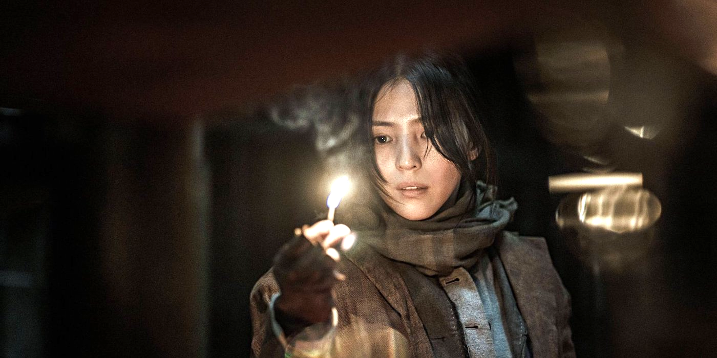 Han So-hee holds a lit match in Netflix's Gyeongseong Creature.