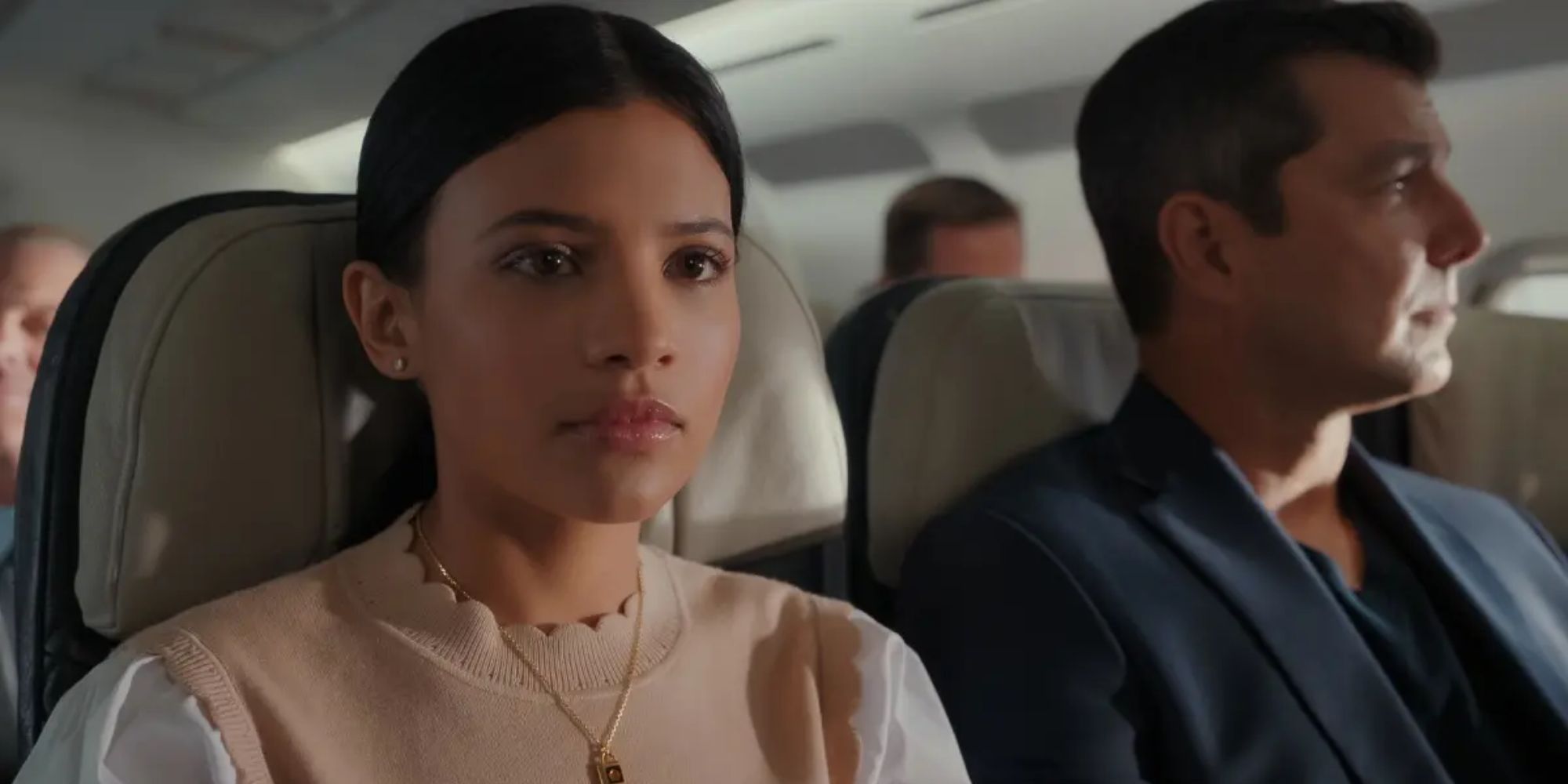 Jackie (Nikki Rodriguez) sitting on a plane with Uncle Richard (Alex Quijano) in My Life With the Walter Boys Season 1 finale