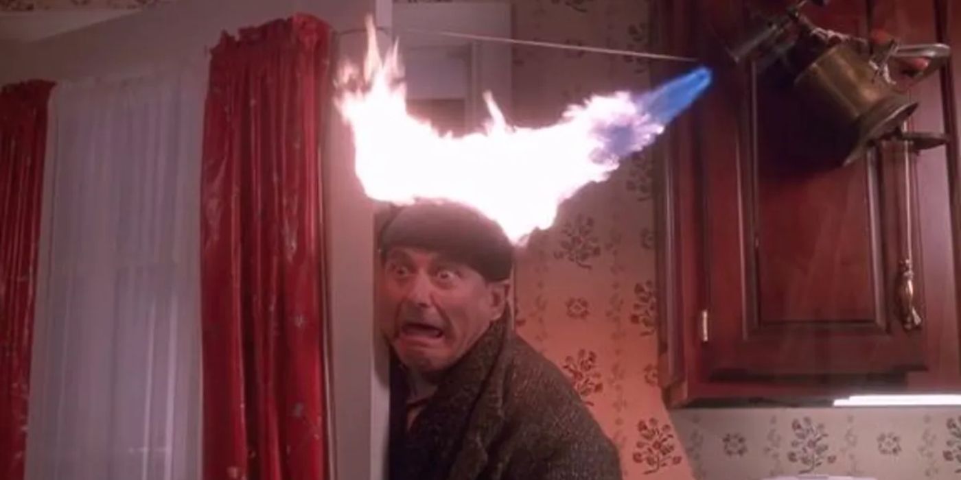 Harry (Joe Pesci) with his head on fire in Home Alone