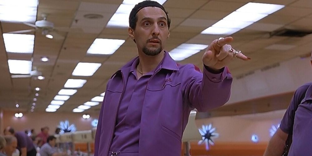 John Turtorro as Jesus Quintana dressed in purple pointing in The Big Lebowski