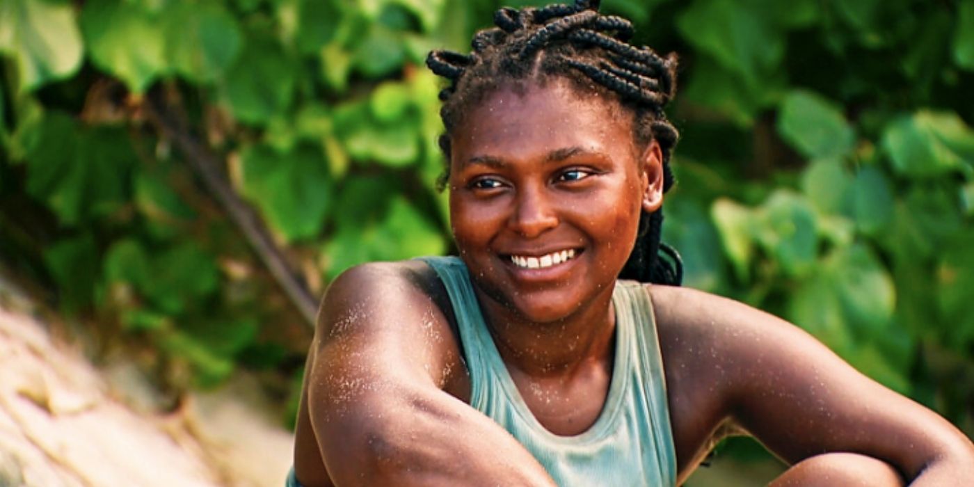 Katurah Topps sits on the beach and smiles on 'Survivor 45'