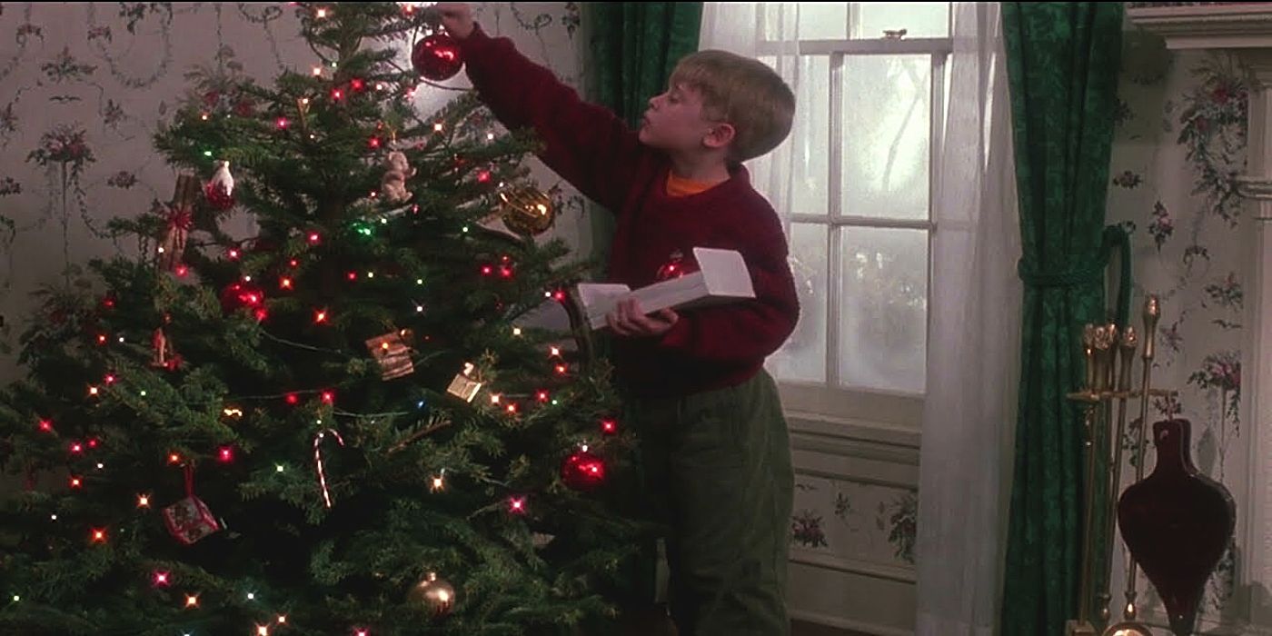 Macaulay Culkin as Kevin McCallister decorating a Christmas tree in Home Alone