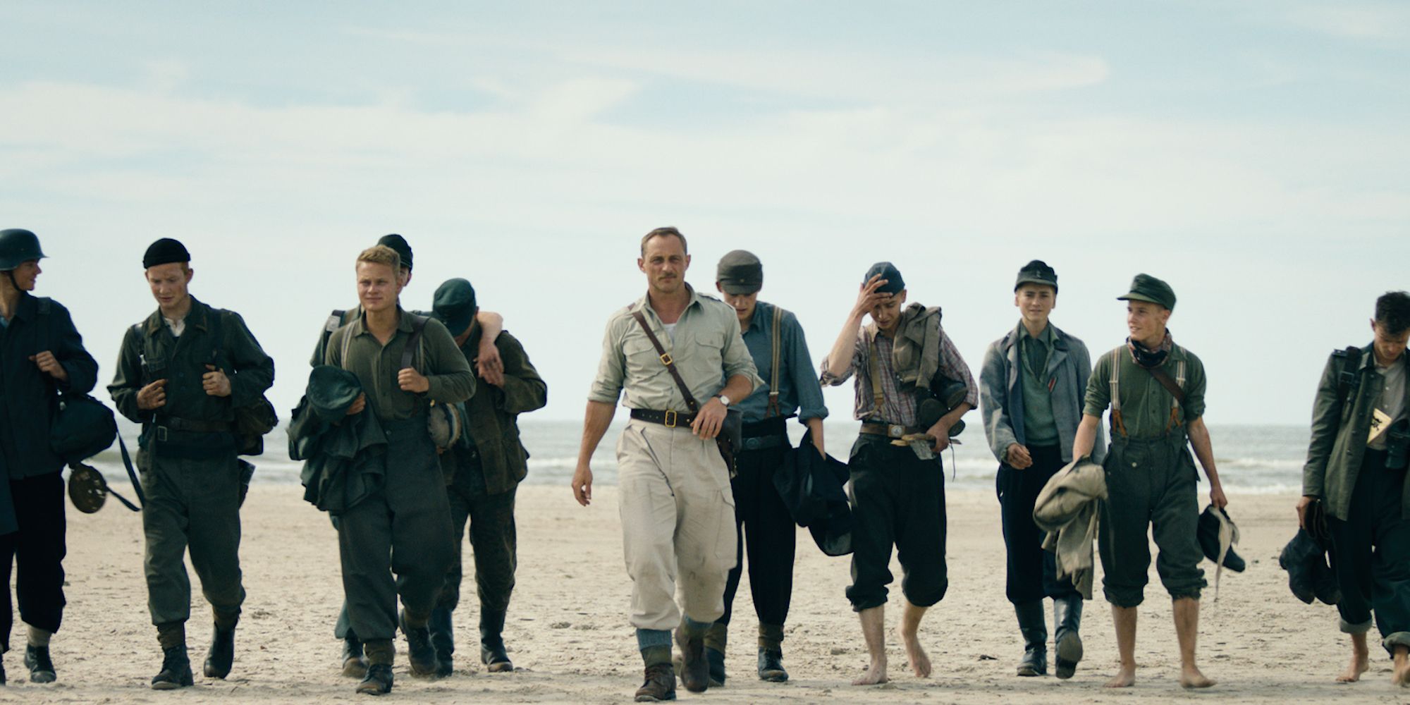 A group of people walking in Land of Mine