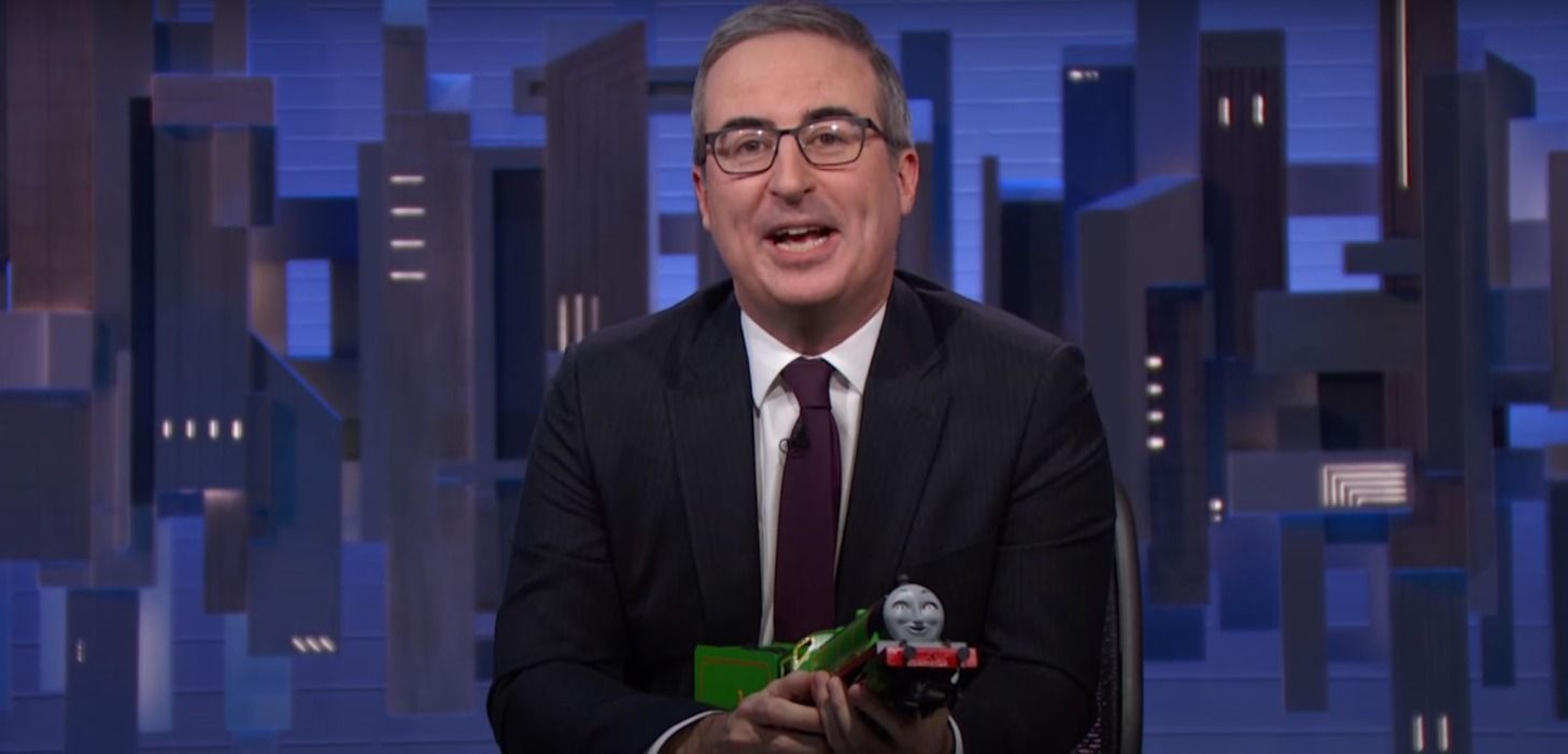 'Last Week Tonight' image shows host John Oliver with a toy train on his hands and facing the camera.