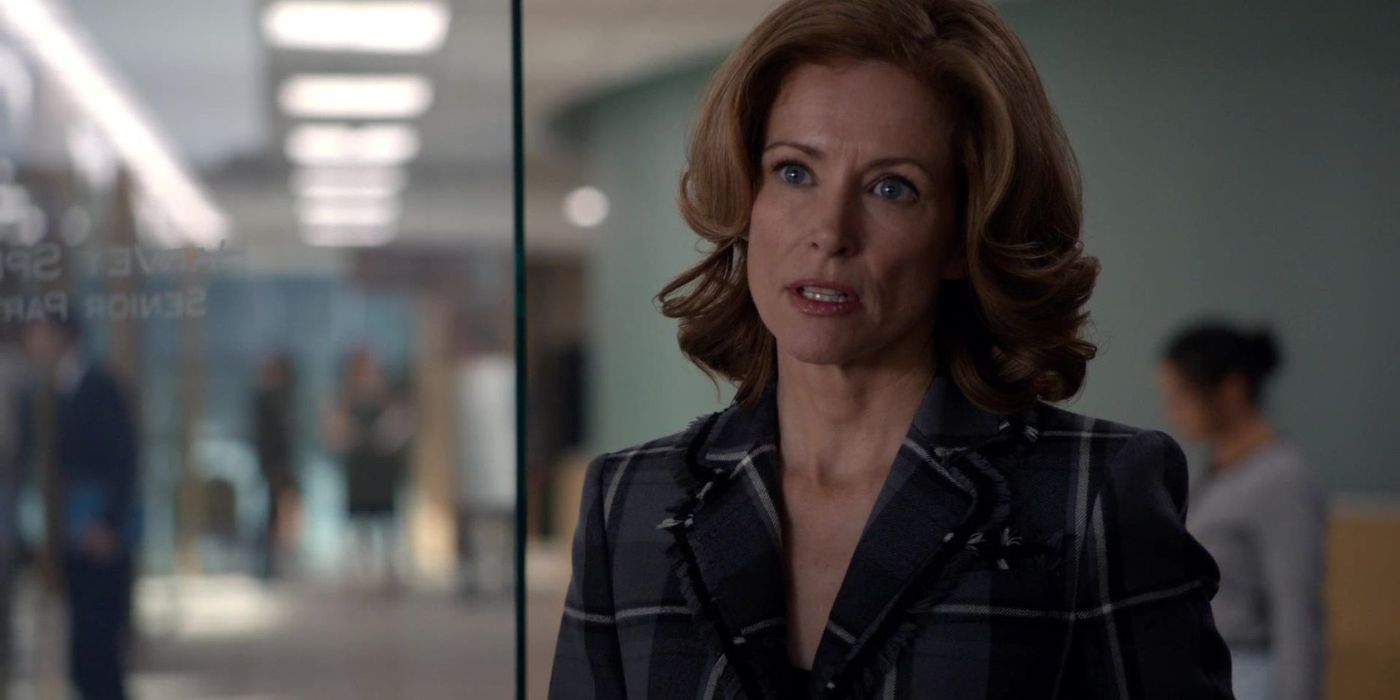 Leslie Hope as Anita Gibbs stands in the doorway of Harvey Specter's office in 'Suits'