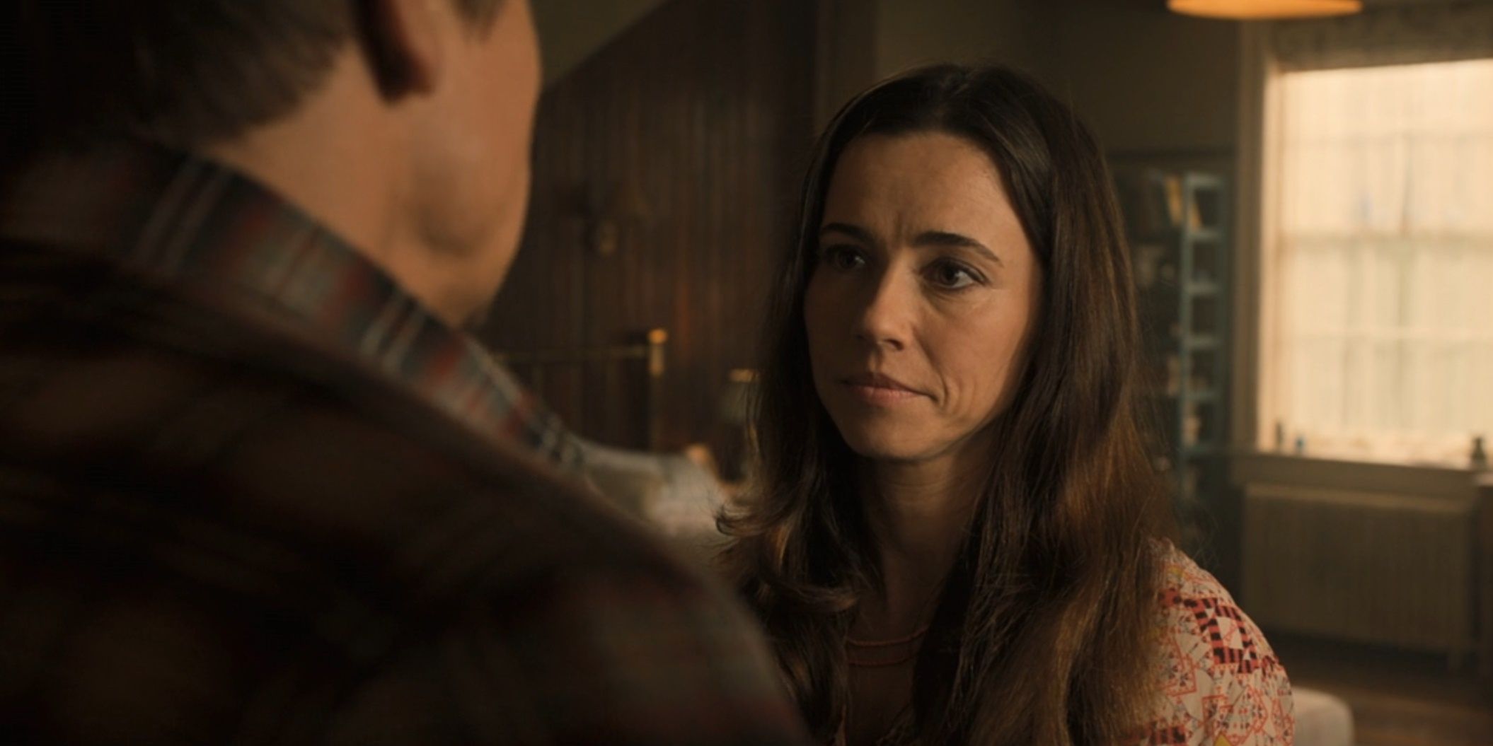 Linda Cardellini as Laura Barton speaks with her husband, Clint Barton, in Avengers: Age of Ultron