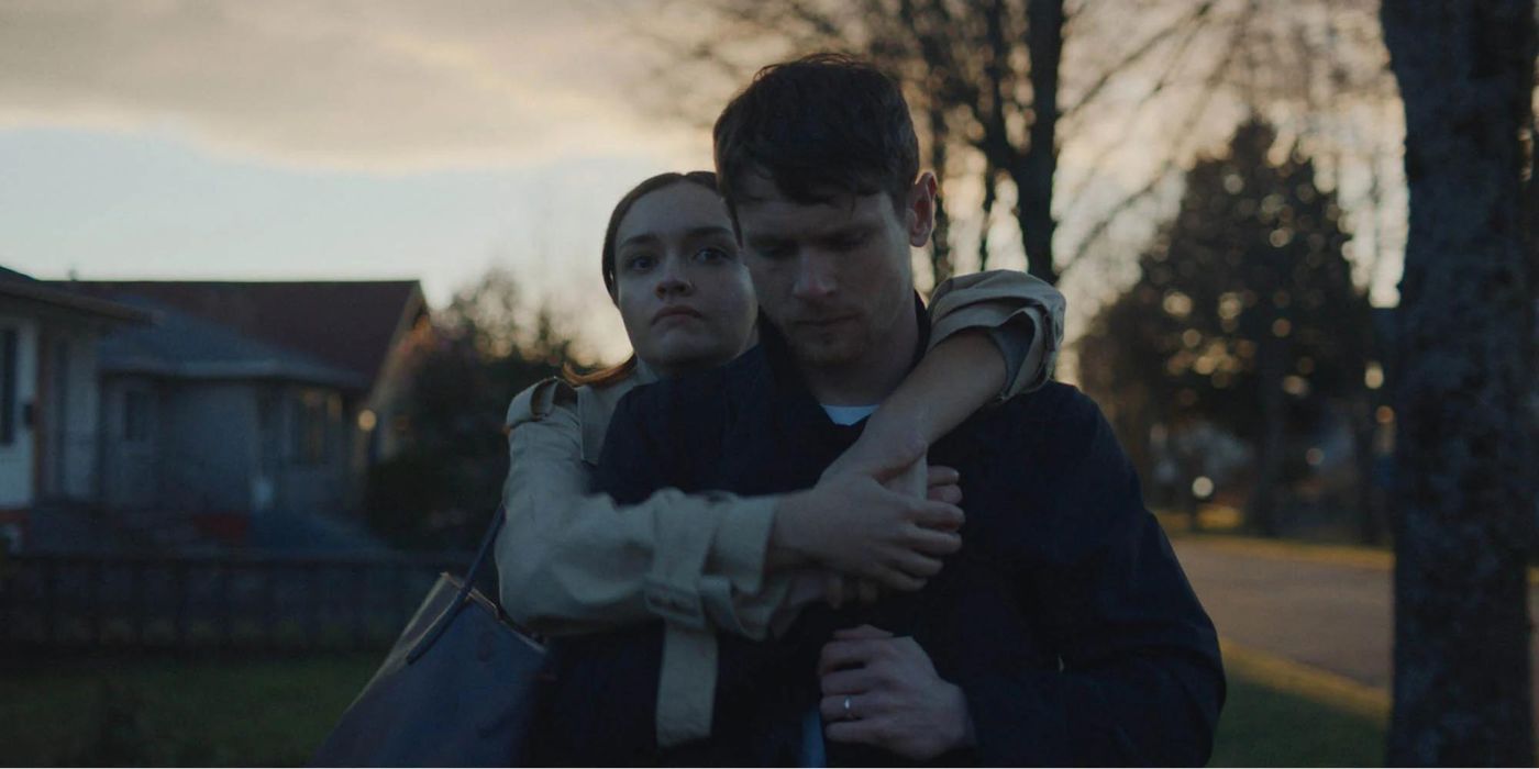 Olivia Cooke hugging Jack O'Connell from behind in Little Fish
