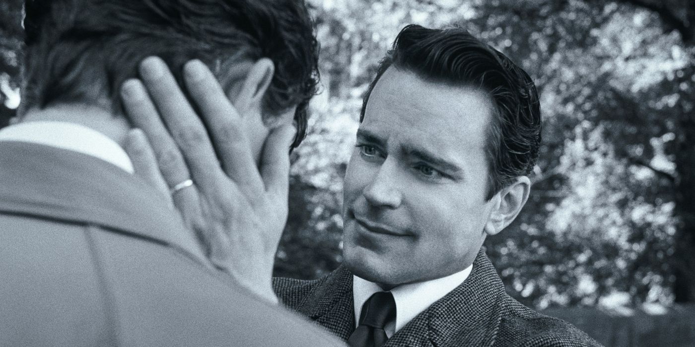 David Oppenheim (Matt Bomer) with his hands on Leonard Bernstein's face in Maestro