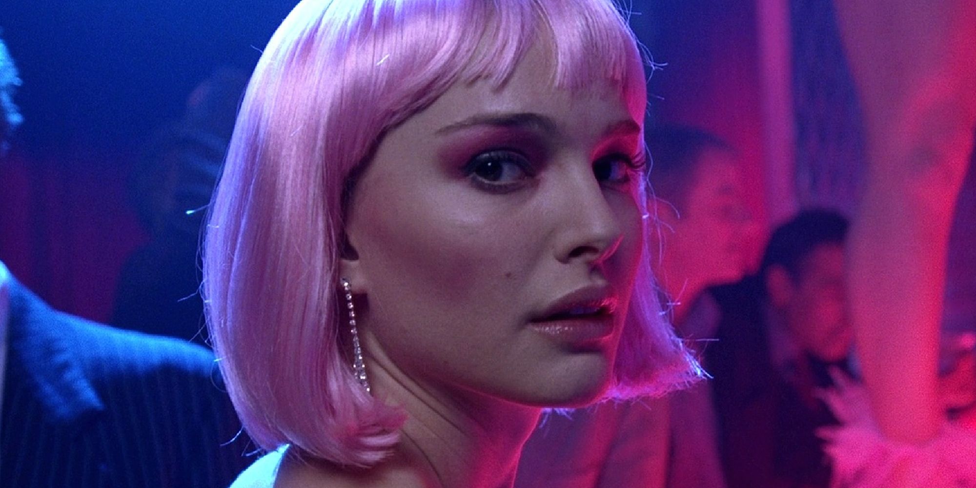 A close-up shot of Natalie Portman with a pink wig in Closer