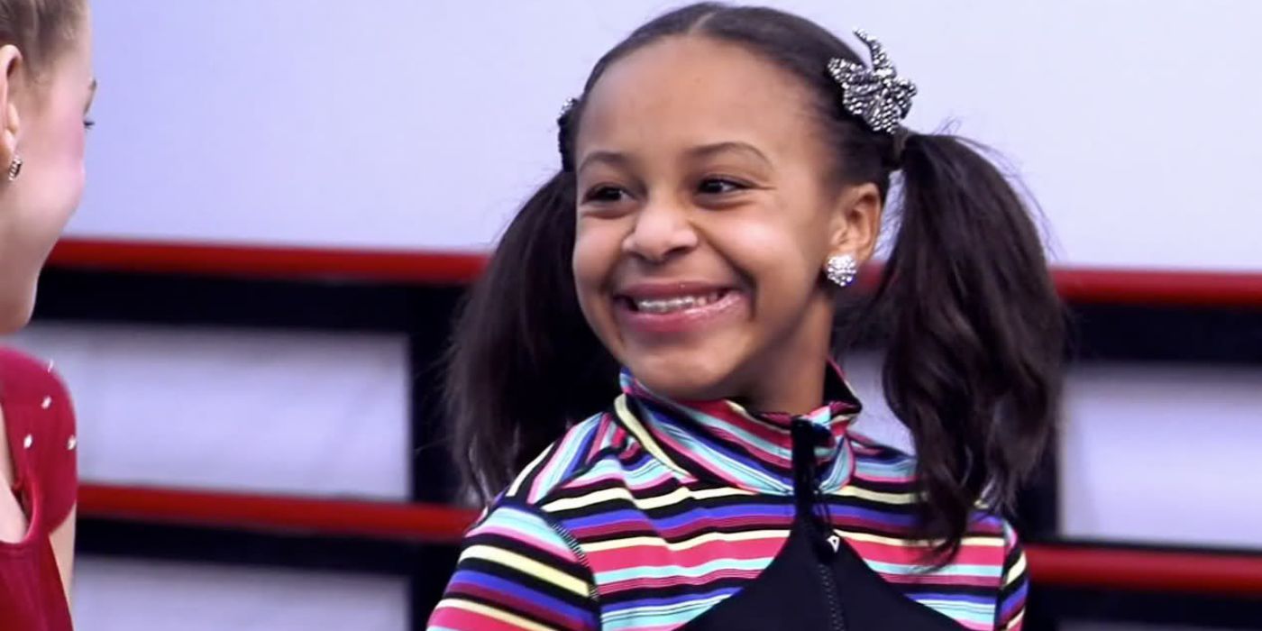 Nia Sioux smiles at her friend during an episode of 'Dance Moms'