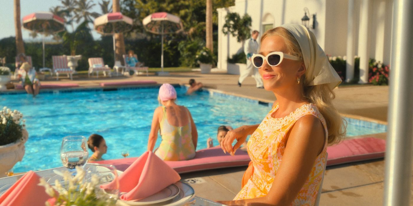 Kirsten Wiig in 'Palm Royale' sits by the pool