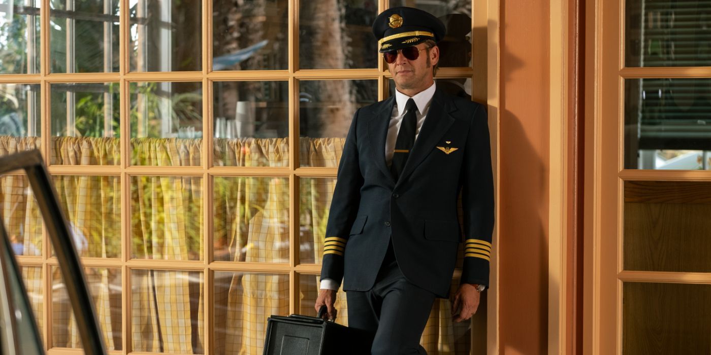 Josh Lucas stands in a pilot's uniform in 'Palm Royale'