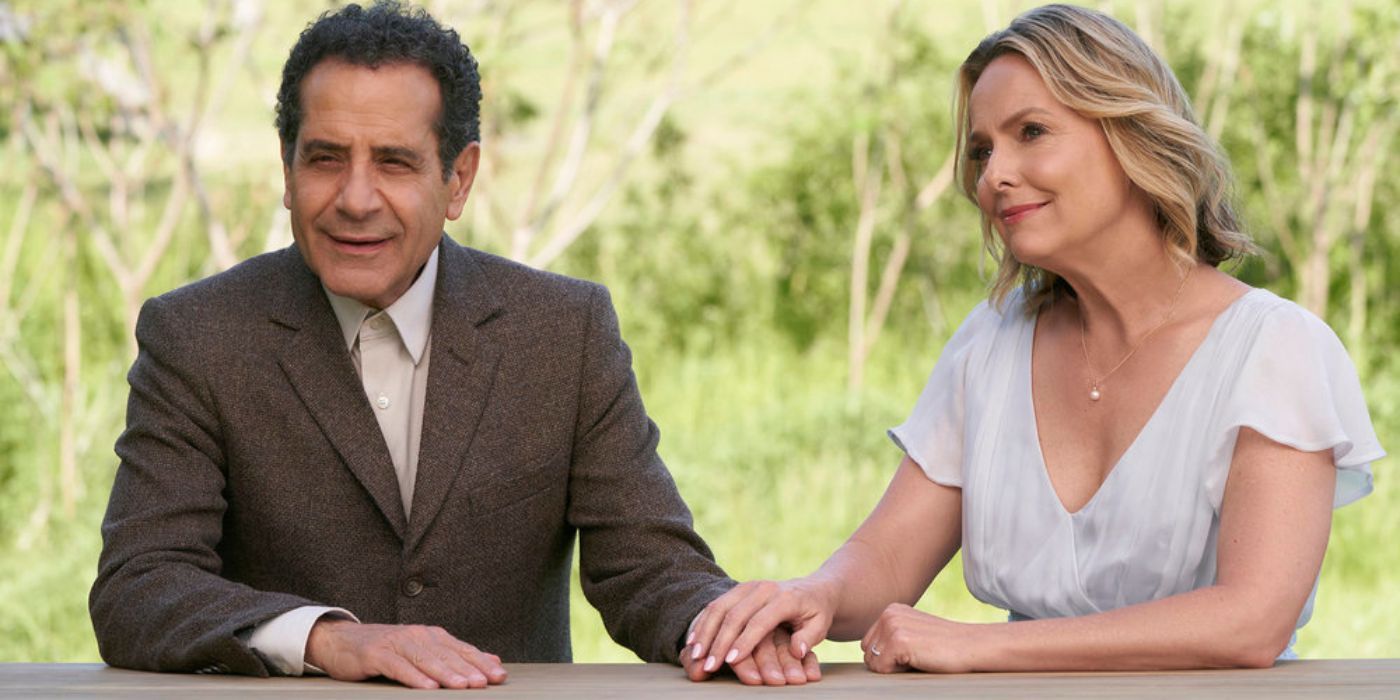 Adrian Monk (Tony Shalhoub) and Trudy (Melora Hardin) holding hands on a wooden bench in Mr. Monk's Last Case: A Monk Movie