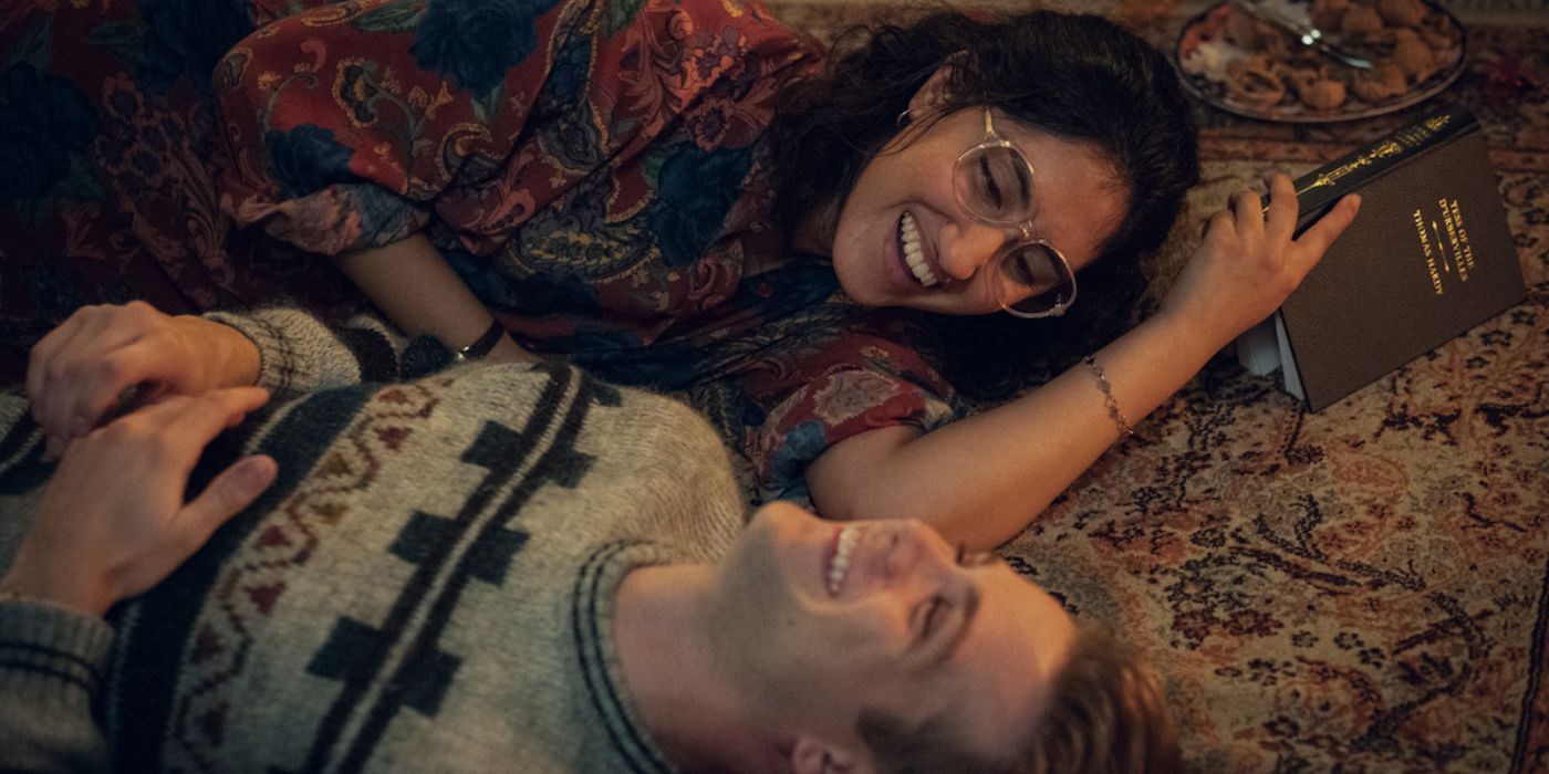 Leo Woodall and Ambika Mod lay on the floor laughing in 'One Day'