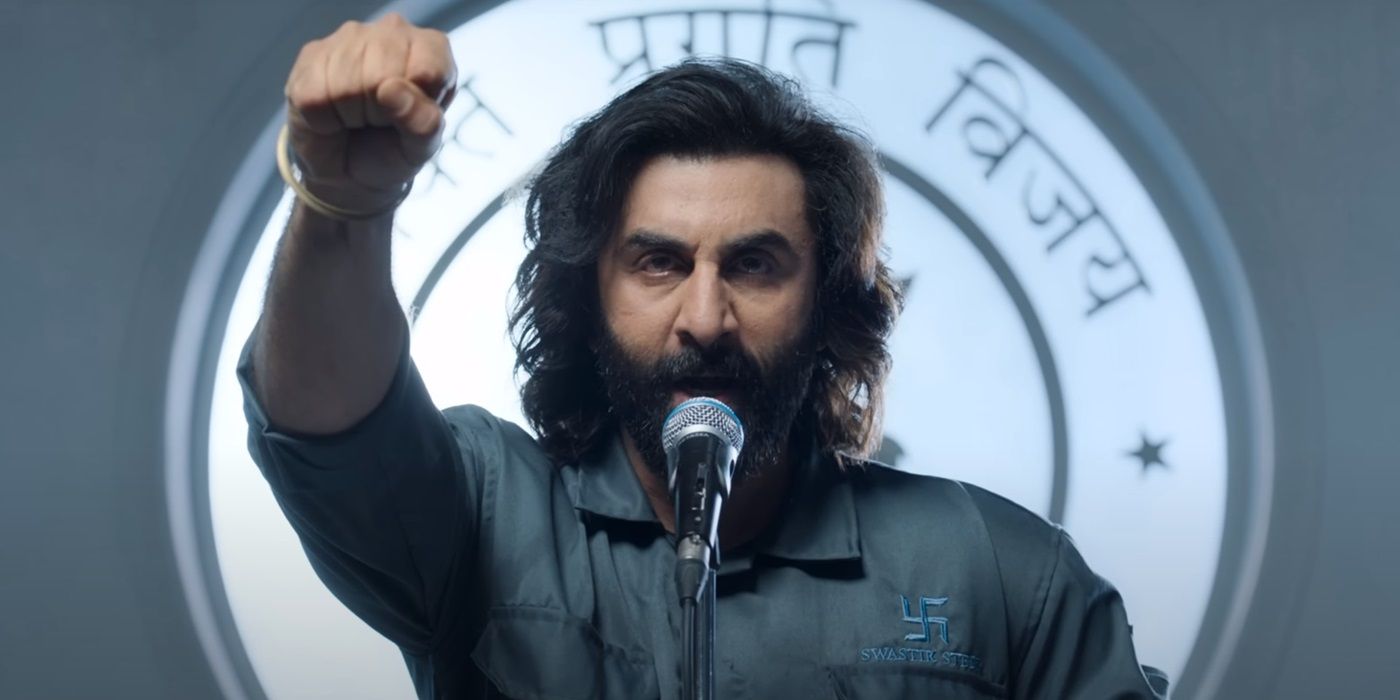 Ranbir Kapoor as Vijay Singh with his hand raised as he gives a speech in Animal (2023)