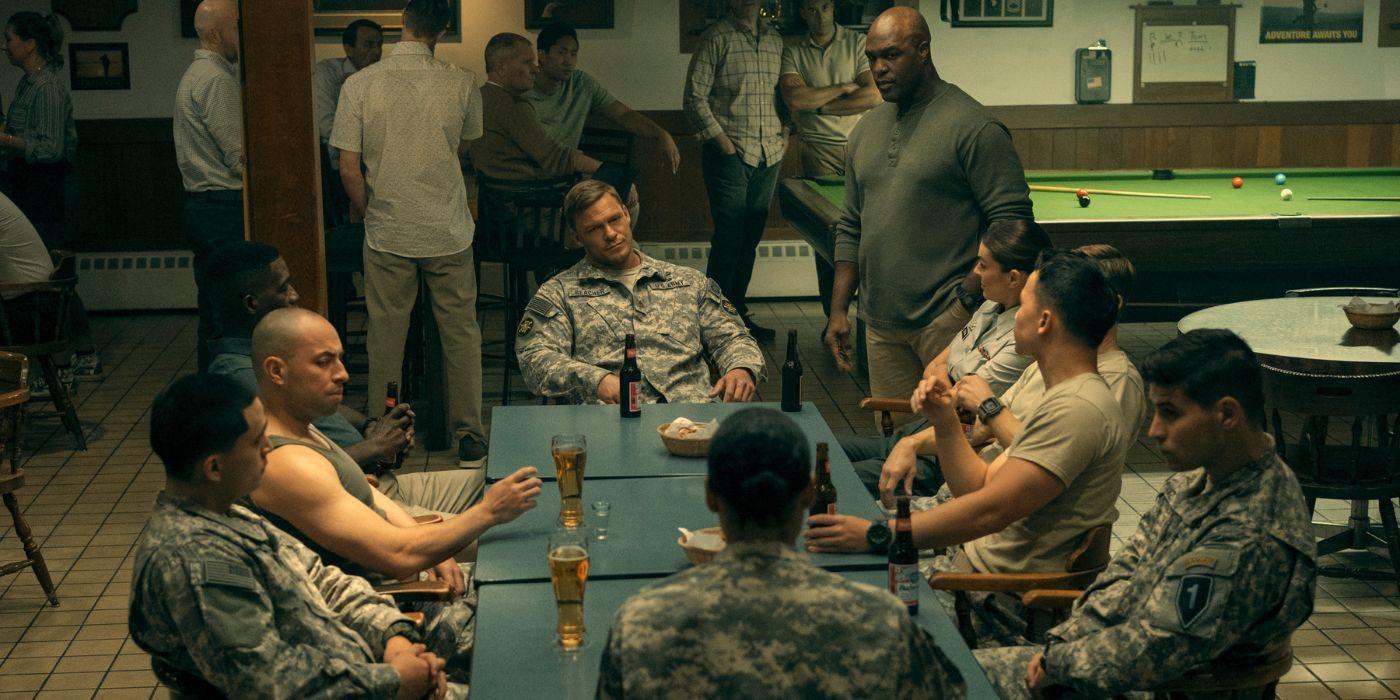 Jack Reacher (Alan Ritchson) having a beer with his military squad in Reacher Season 2.