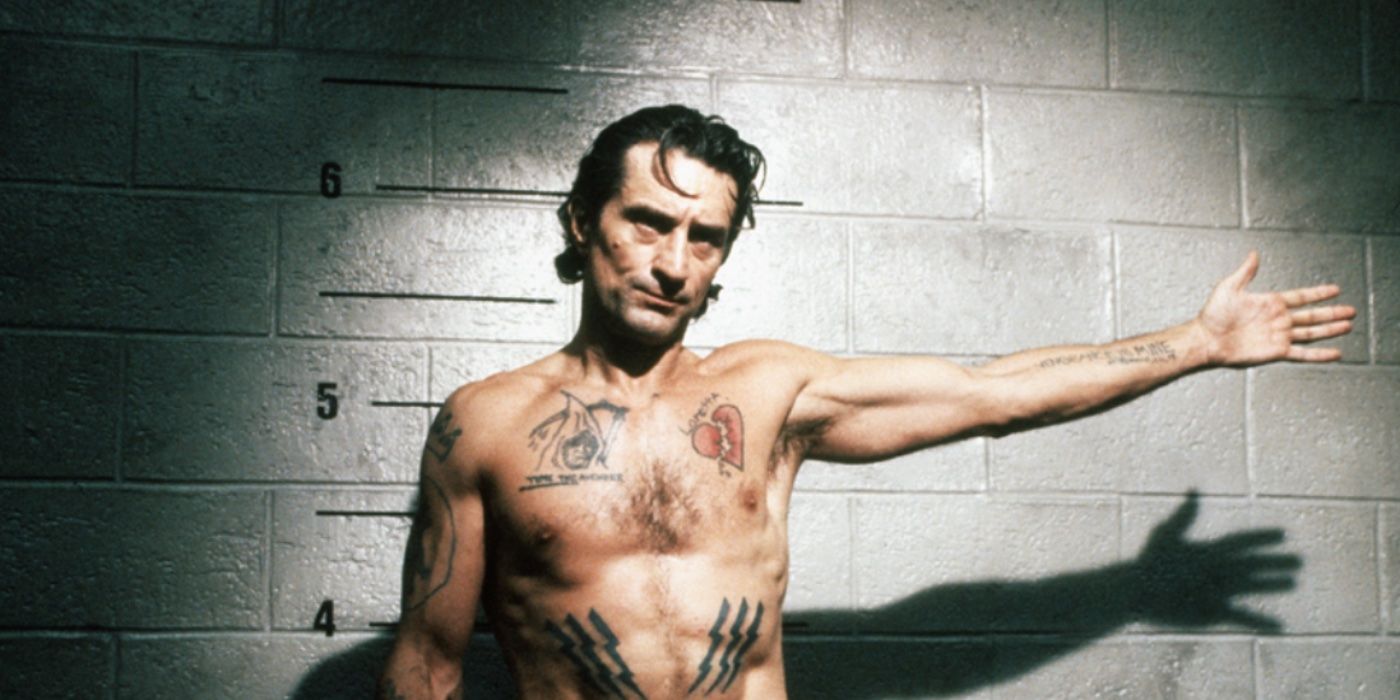 Max Cady with his arm outstretched for a mug shot in Cape Fear (1991)