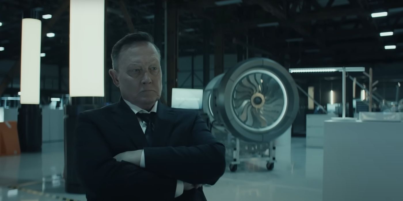 Shane Langston (Robert Patrick) sitting in an airplane hanger in Reacher Season 2