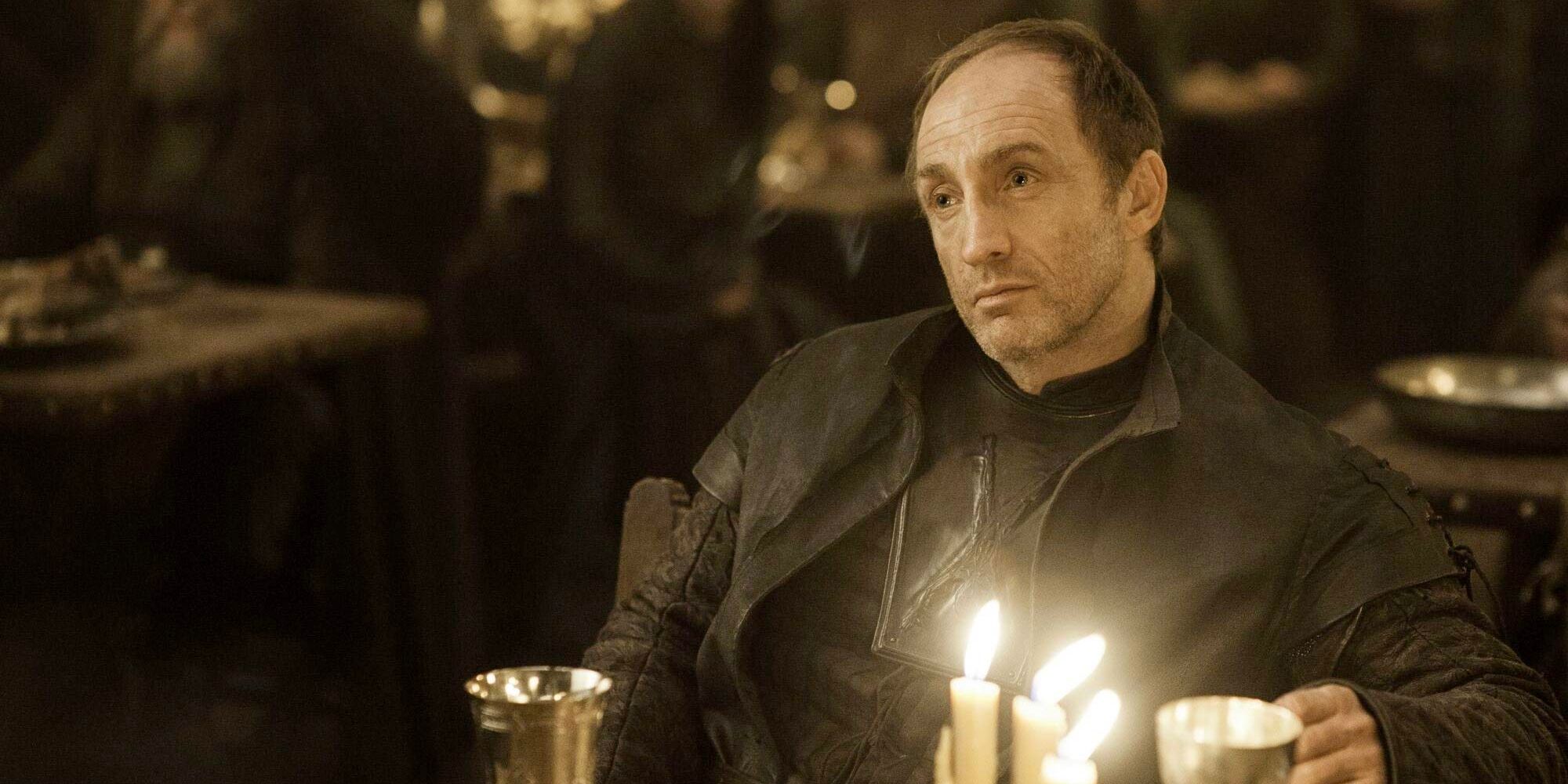 Roose Bolton sits down in the hall for the Red Wedding in Game of Thrones