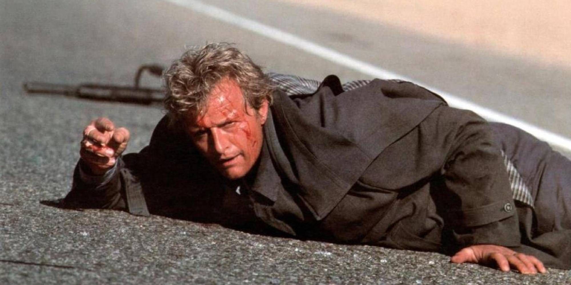 Rutger Hauer lying on the ground in The Hitcher