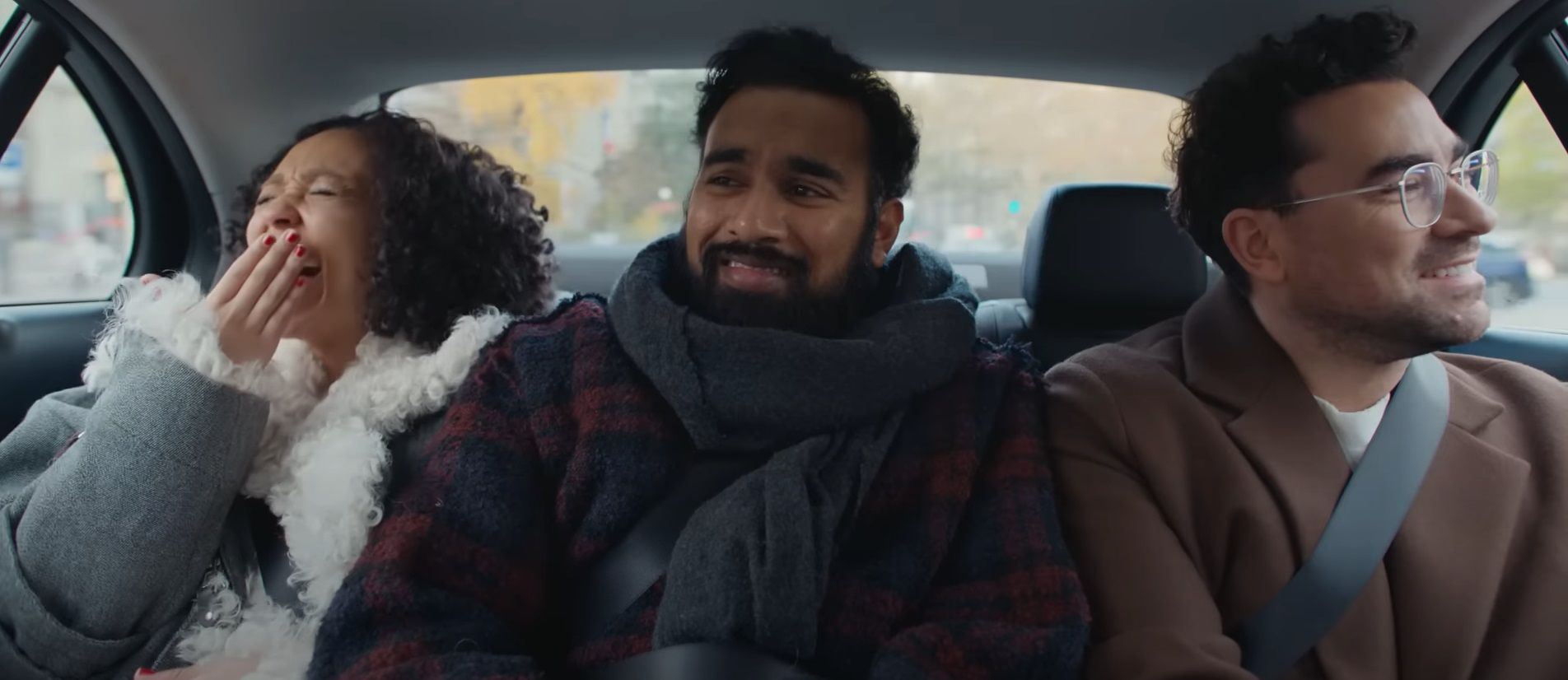 Ruth Negga, Himesh Patel, and Dan Levy riding in the back seat of a cab in Good Grief