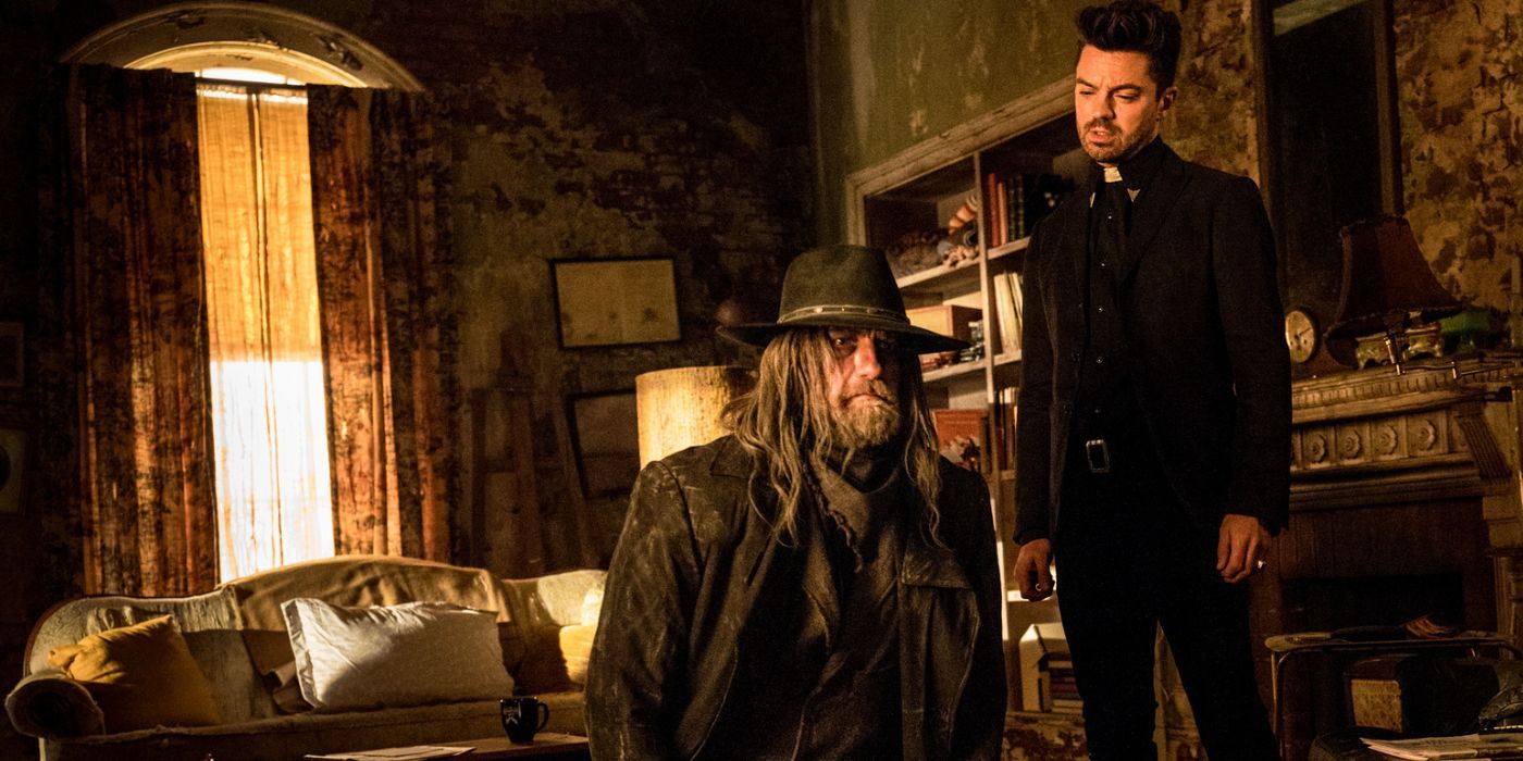 Jesse (Dominic Cooper) staring down at a kneeling Saint of Killers (Graham McTavish) in Preacher