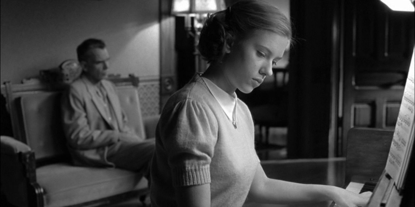 Scarlett Johansson as Birdy Abundas playing the piano while Ed sits in the back in The Man Who Wasn't There