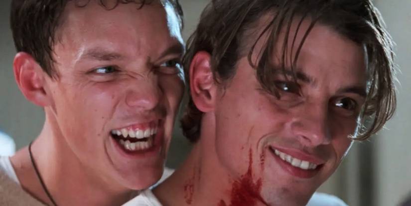 Stu Macher and Billy Loomis smiling with blood on their faces in Scream.