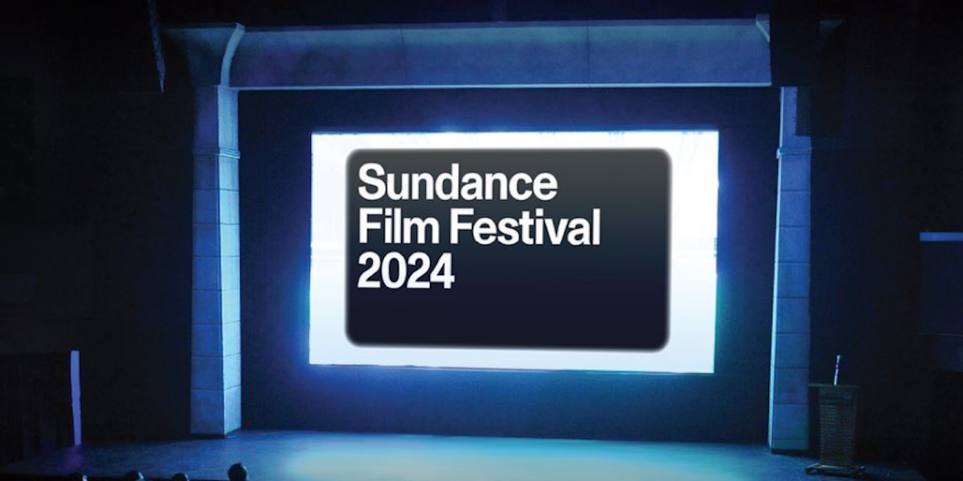 A dark theater with a screen lit up that reads Sundance Film Festival 2024. 