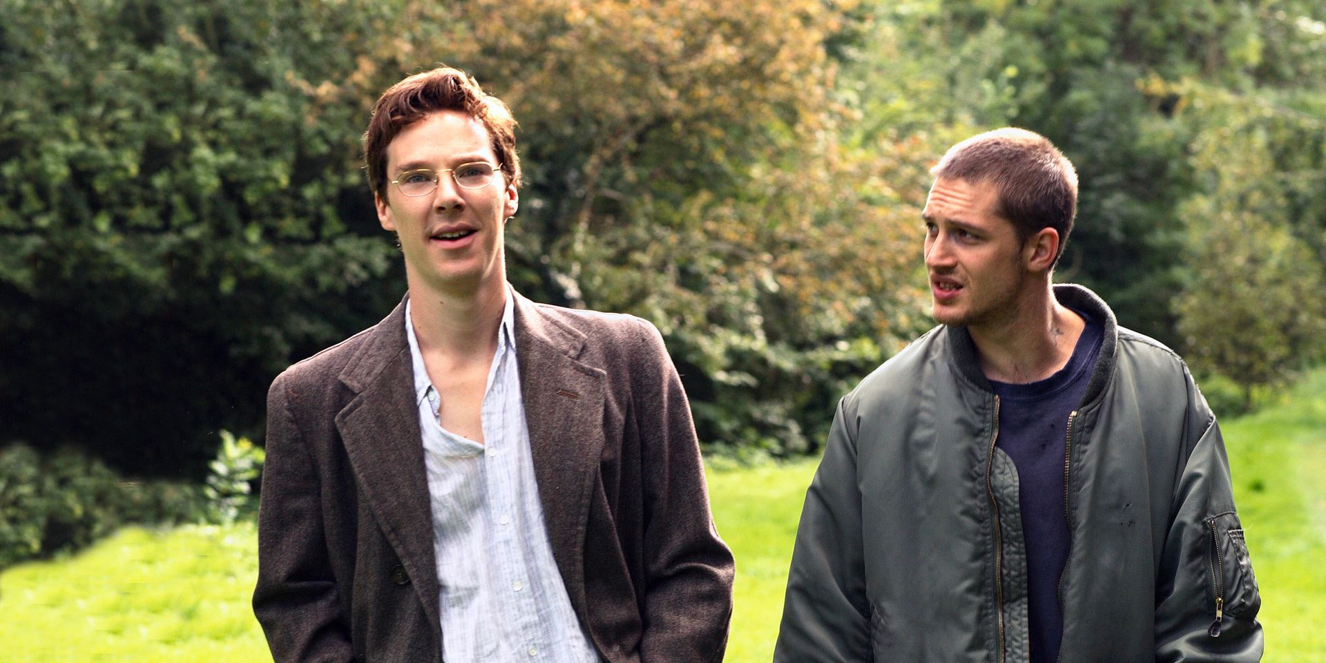 Alexander Masters (Benedict Cumberbatch) and Stuart Shorter (Tom Hardy) walk together in a park in 'Stuart: A Life Backwards'