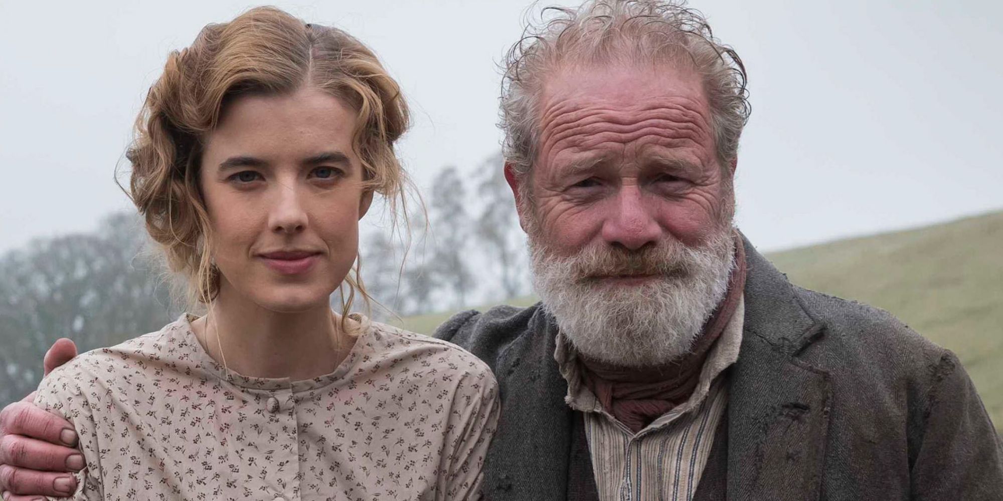 Agyness Deyn and Peter Mullan and Chris and John Guthrie smiling at the camera in Sunset Song
