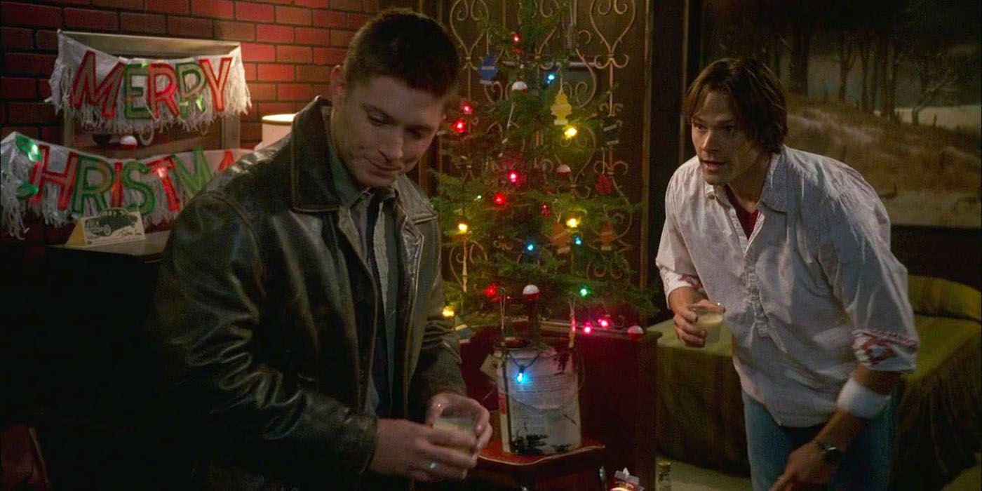 Sam and Dean exchange Christmas presents in a scene from Supernatural