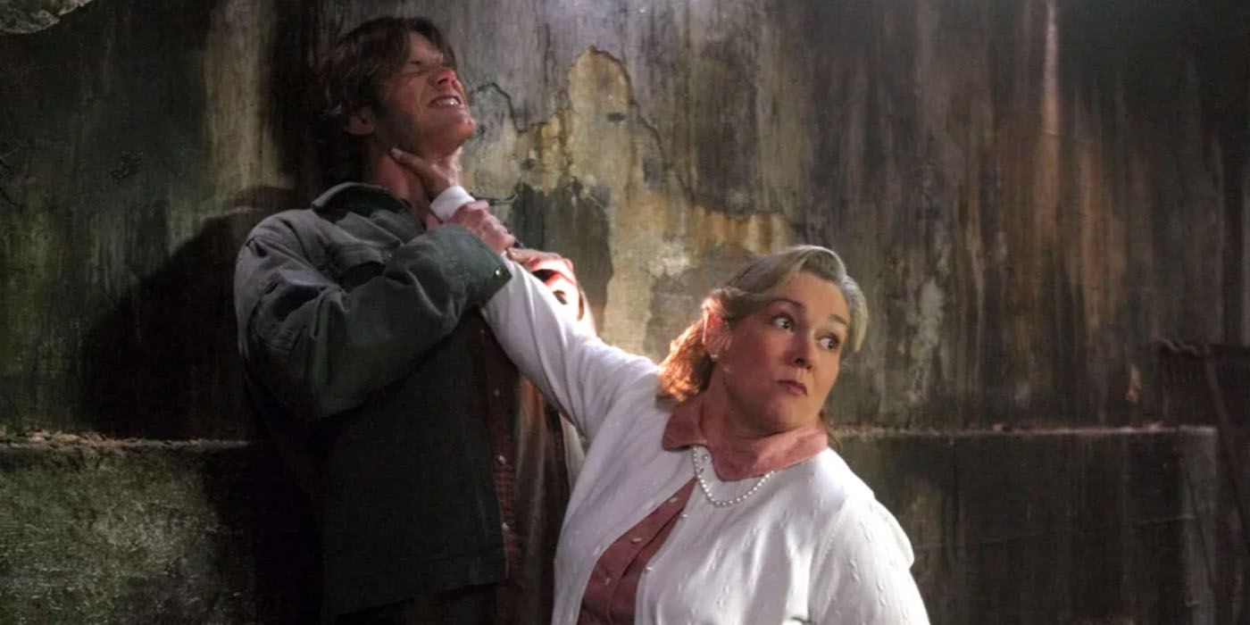 Sam Winchester (Jared Padalecki) is being attacked and held up against a wall by a pagan god.