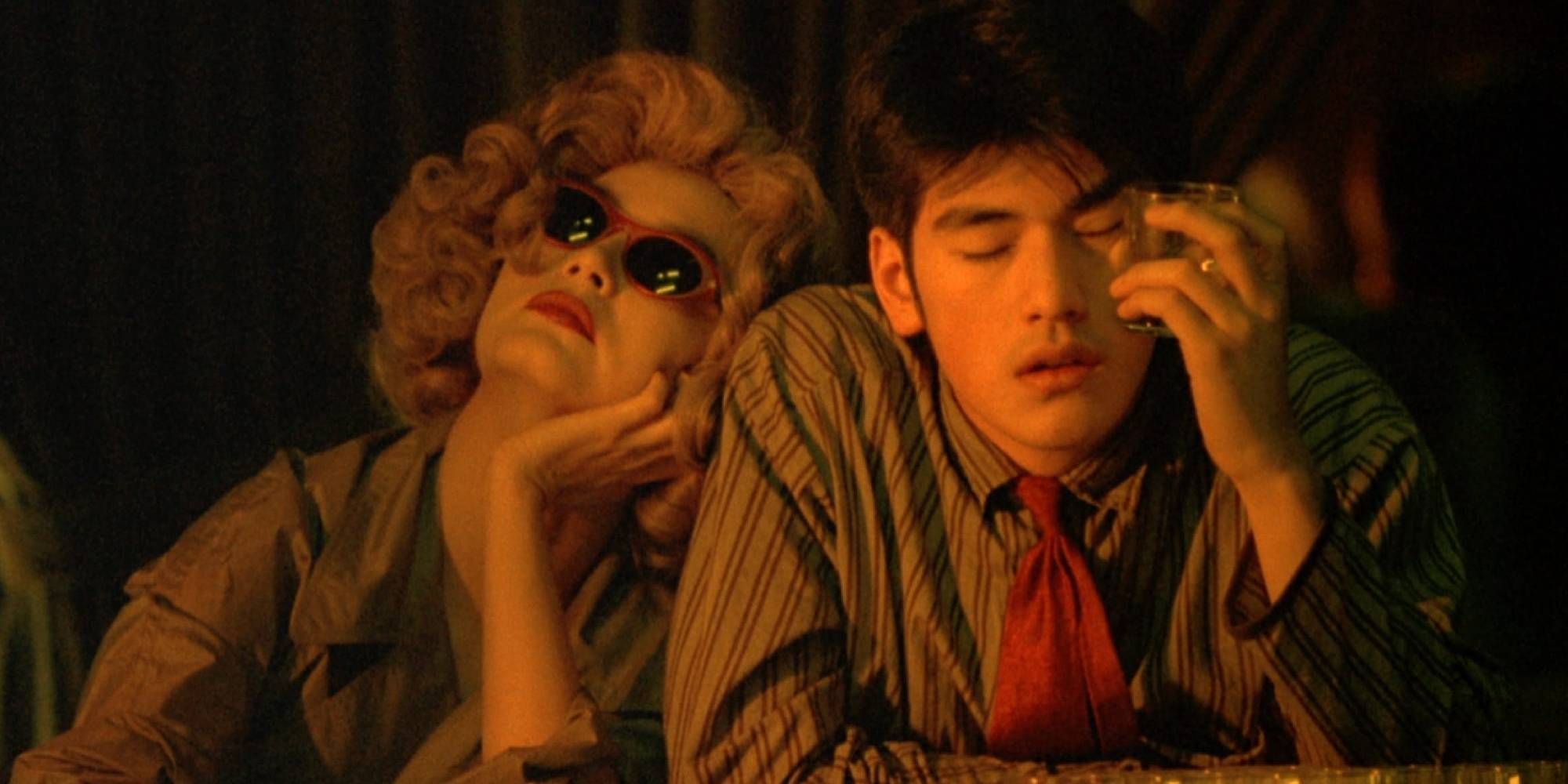 Takeshi Kaneshiro and Brigitte Lin looking drunk in a bar in Chungking Express