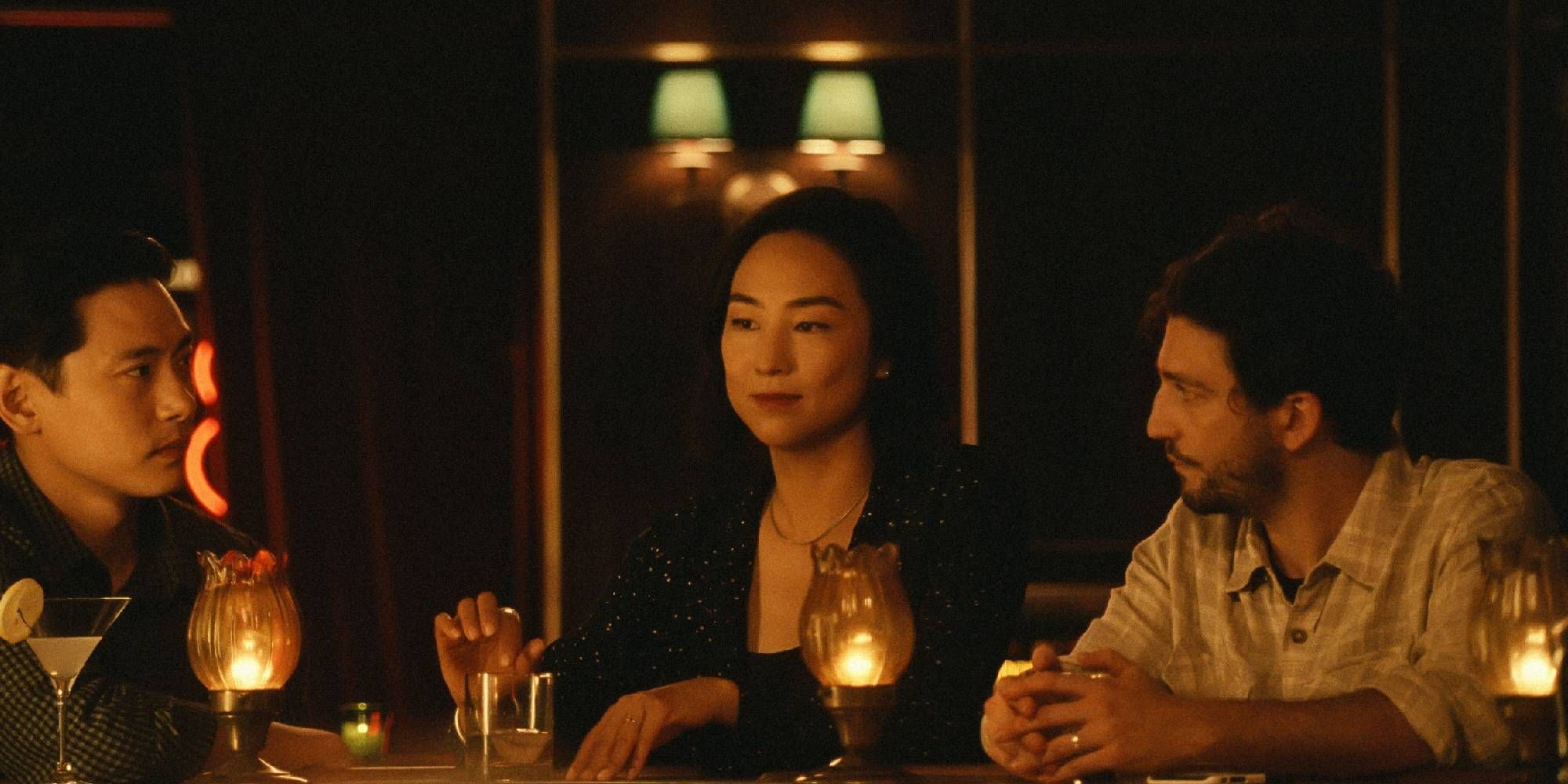 Hae Sung (Teo Yoo), Nora (Greta Lee), and Arthur (John Magaro) sit at a bar and talk in 'Past Lives'