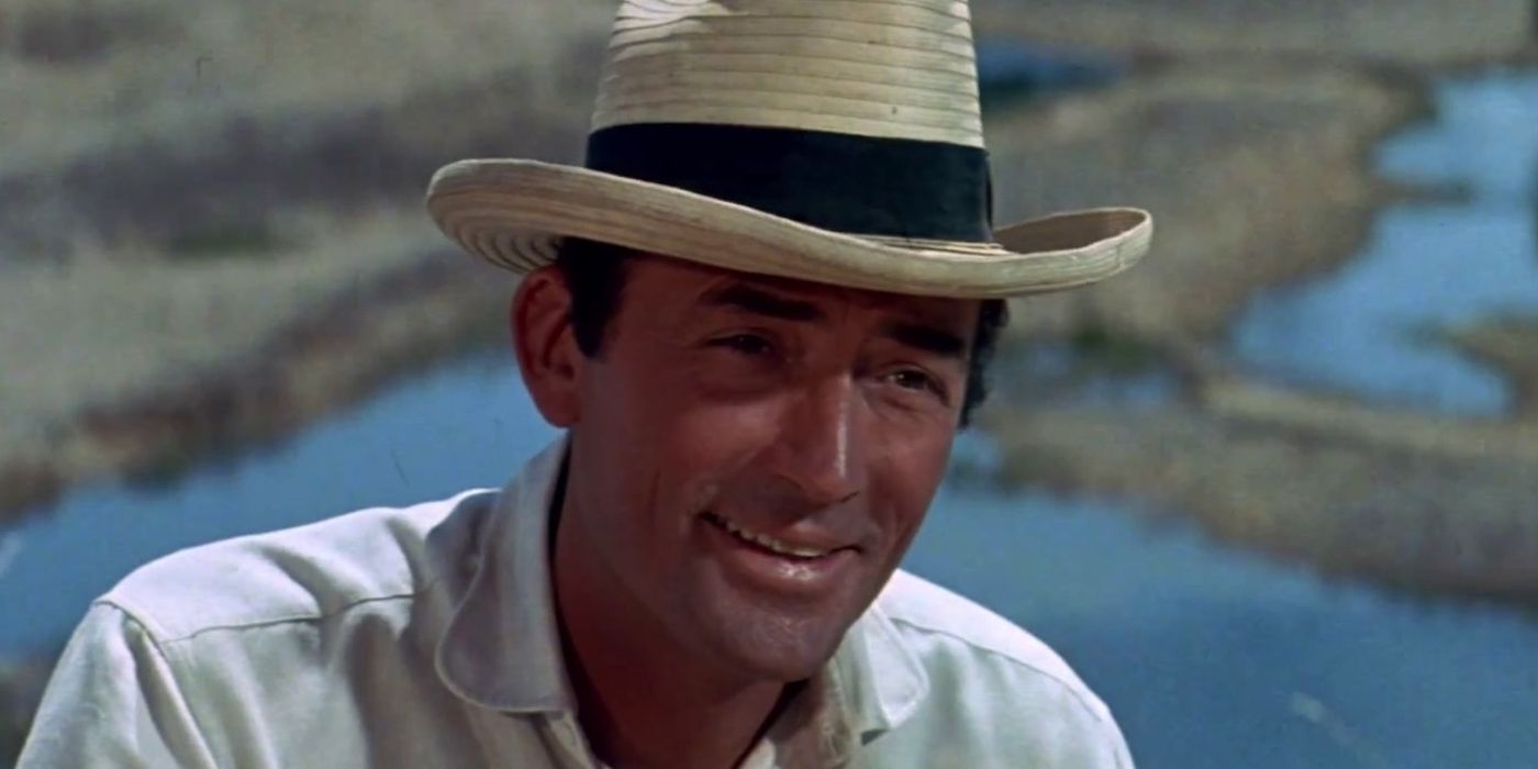 Gregory Peck as McKay smiling at a person offscreen in The Big Country