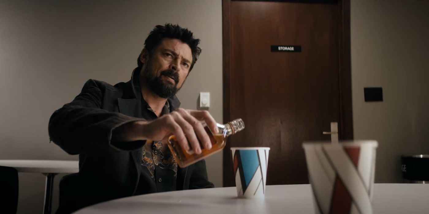 Billy Butcher (Karl Urban) pouring scotch in a paper cup in The Boys Season 4