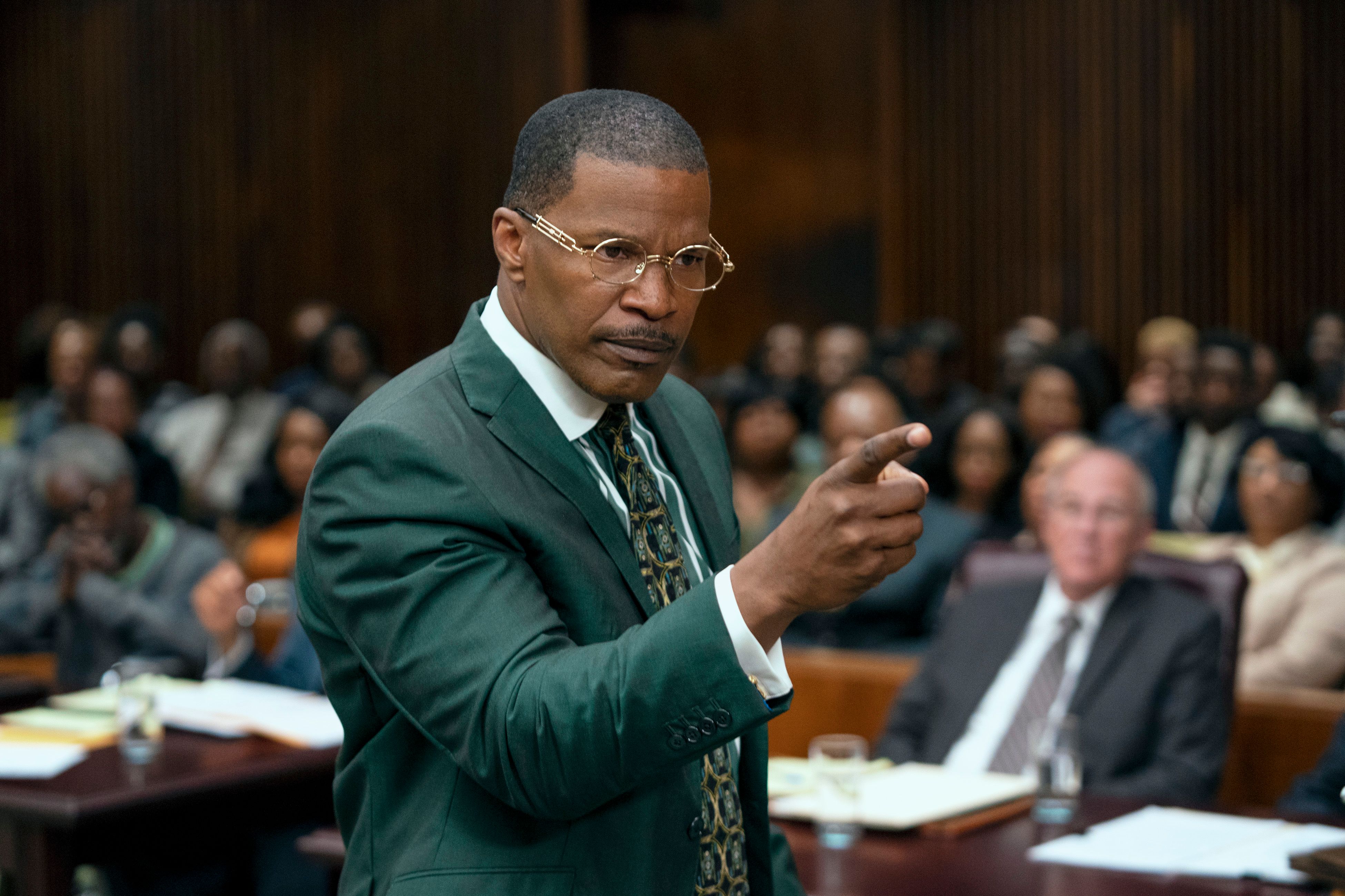 Jamie Foxx as Willie E. Gary in a court room in The Burial