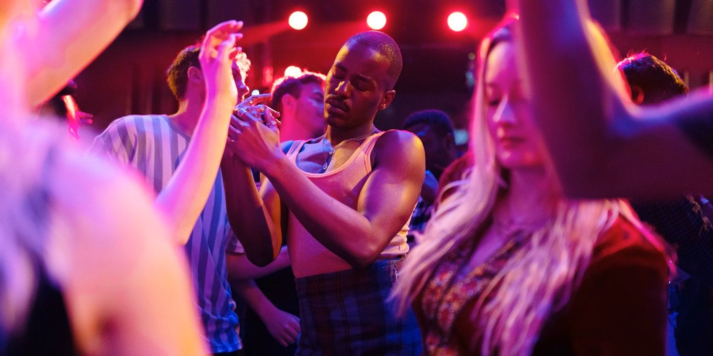 Ncuti Gatwa wearing a tank top & plaid kilt dancing in a club in Doctor Who: The Church on Ruby Road