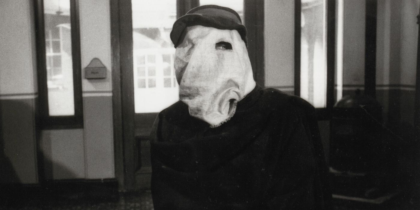 John Hurt with his face covered in The Elephant Man